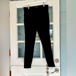 Abercrombie and Fitch ultra high-rise black jeans with frayed hem.